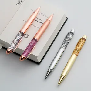 Detail shot of glitter crystal ballpoint pens in rose gold, gold, and silver metal.