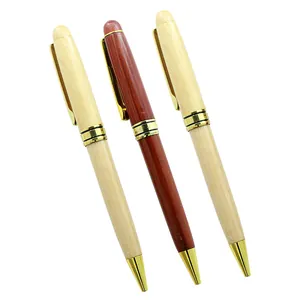 Close-up of elegant wooden ballpoint pens featuring maple and dark wood finishes with gold accents
