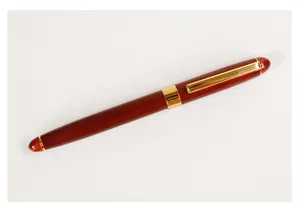 Classic red wood rollerball pen featuring an elegant gold metal clip and vintage design