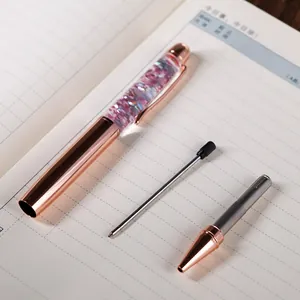Elegant rose gold ballpoint pen with pink sequins and replaceable metal refill