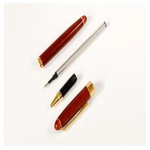 Detail view of a retro redwood rollerball pen showing its internal components and refill.