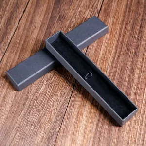 Premium elegant black cardboard gift box for single fountain pen on a wooden background