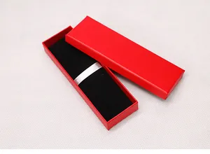Detailed view of long rectangular red gift box with premium black velvet lining and silver ribbon