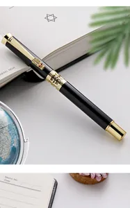 Close-up of luxury business rollerball pen featuring an ornate dragon head clip