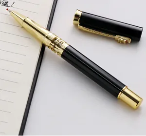 Luxury black and gold metal gel pen with detailed dragon head clip on notebook