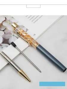 Detailed view of disassembled gold foil crystal ballpoint pen showing components and 7cm refill