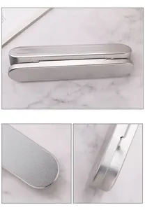 Close-up view showing the fine matte silver texture and hinge of the metal pen box.