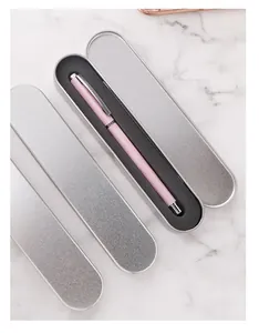 Close-up of a pink pen stored in a silver tin case with black EVA foam lining insert