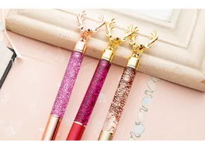 Close-up detail of creative reindeer liquid sand ballpoint pens with sparkling glitter barrels