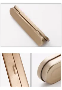 Close-up detail of champagne gold tinplate box with rounded edges and matte finish