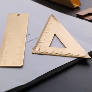 Vintage brass ruler set including straight and triangle rulers for professional use