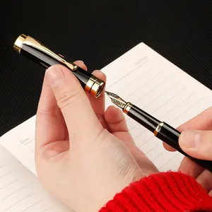 Luxurious black and gold metal fountain pen set with elegant engraving for calligraphy