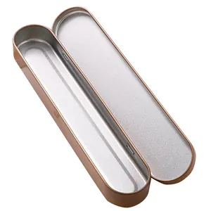 Rose gold long oval tin box for pens and cosmetic tools with silver interior.