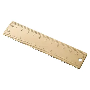 Vintage brass 12cm straight ruler with dual centimeter and inch scales and wavy edge