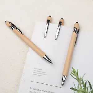 Natural bamboo ballpoint pen and stylus touch pen with metallic clip on notebook