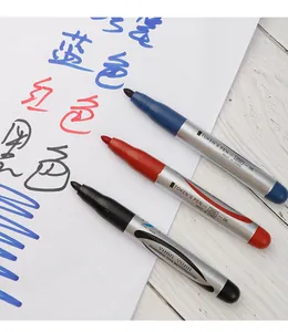 Detail view of three YUAN YUAN permanent markers showing writing effects in blue, red, black