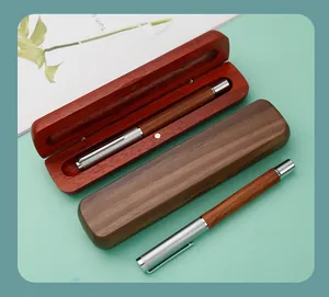 Detailed view of handcrafted wooden fountain pens and matching wooden gift cases