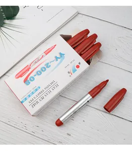 Professional red oil-based permanent markers set in original packaging on desk