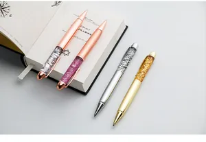 Detail view of sparkling quicksand ballpoint pens with liquid glitter metal bodies