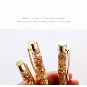 Close-up of elegant gold foil floating pens with luxury metal accents