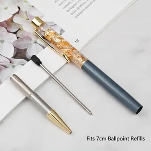 Luxurious gold foil crystal ballpoint pen with a 7cm refill shown in a disassembled view