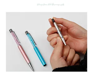 Detail shot showing the internal metal refill of a crystal rhinestone ballpoint pen