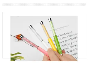 Macro view of elegant crystal-filled ballpoint pens with vibrant metallic barrels and silver clips