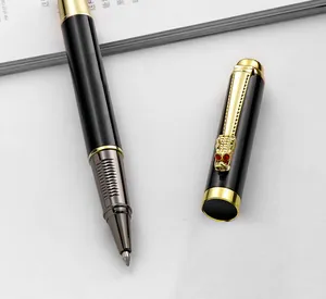 Detailed view of a black metal rollerball pen featuring a golden dragon head clip design.