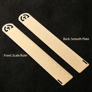 Vintage 15cm brass bookmark ruler with hollow design, showing front and back views.