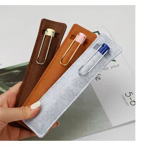 Close-up of three colorful felt pen sleeves held in hand for fountain pen protection