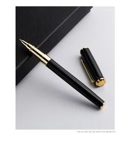 Elegant black and gold professional metal rollerball pen shown next to a black notebook