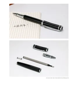 Detailed view of disassembled black metal rollerball pen showing internal components