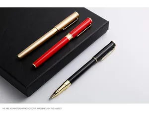 Detailed macro shot of premium gold, red, and black metal business rollerball pens.