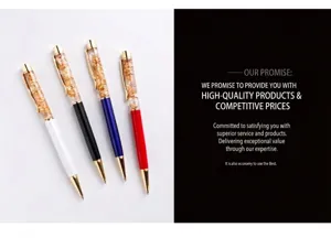Macro view of four elegant gold foil ballpoint pens in white black blue and red