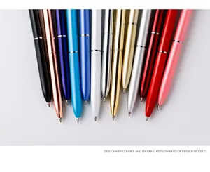 Detailed view of colorful slim metal ballpoint pens in various metallic finishes