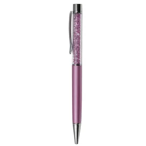 Elegant metal ballpoint pen with sparkling purple crystals in the barrel