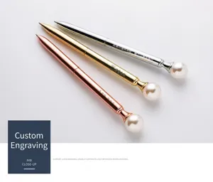 Detail of metallic pearl ballpoint pens in gold, silver, and rose gold with engraving