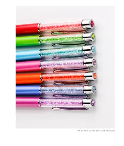 Macro detail of colorful crystal ballpoint pens with shimmering rhinestones and metal clips