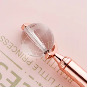 Elegant rose gold metal ballpoint pen with a rotating crystal globe for office gifts