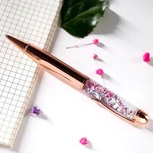 Elegant rose gold quicksand ballpoint pen with sparkling pink glitter and sequins