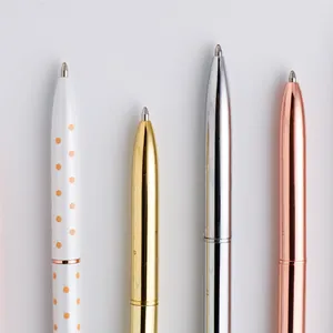 Sleek metal ballpoint pens in gold, silver, rose gold and white polka dot design