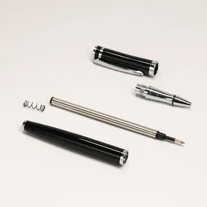 Disassembled black metal business rollerball pen with 0.5mm metal refill and spring