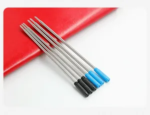 Detailed macro view of metal ballpoint pen refills in black and blue ink colors