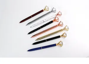 Detailed showcase of diverse metal ballpoint pens topped with large crystal gems