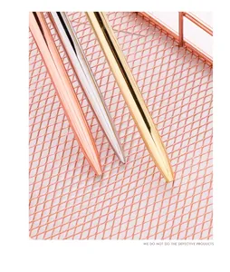 Close-up of sleek metallic ballpoint pens in rose gold, silver, and gold finishes.