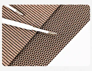 Close-up detail of a white plastic ballpoint pen refill tip on woven mat