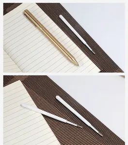 Detailed macro view of durable white plastic ballpoint pen refills paired with a brass pen