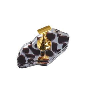 Nail art practice stand with magnetic holder and cow print acrylic base for display
