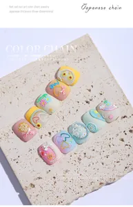 Close-up of 3D colorful nail art chains with heart and flower charms on stone display