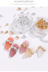 Macro view of sparkling zircon nail art crystals in various geometric shapes and sizes.